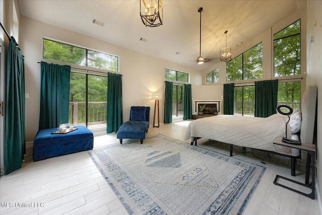 6821 Autumn Oaks Dr, Olive Branch, MS 38654 - bedroom featuring a chandelier and high vaulted ceiling