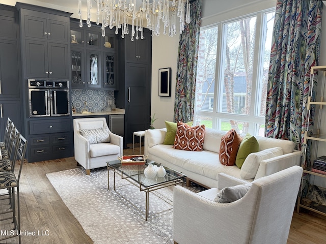 307 Grand Blvd, Greenwood, MS 38930 - living area with light wood-style flooring and a chandelier