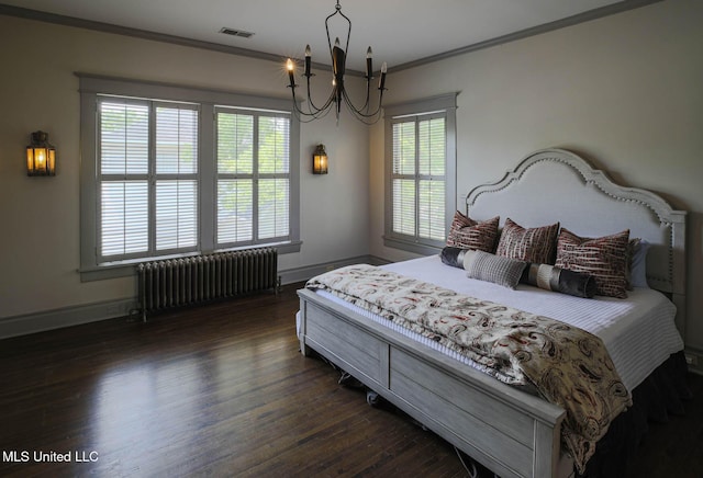 307 Grand Blvd, Greenwood, MS 38930 - bedroom featuring visible vents, crown molding, dark wood-style flooring, baseboards, and radiator heating unit