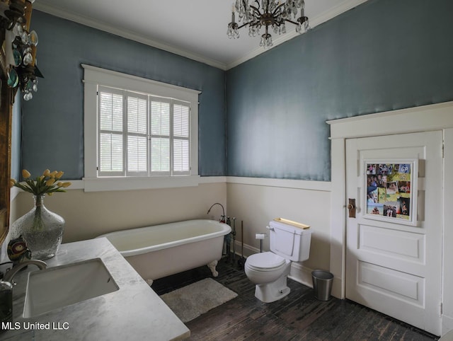 307 Grand Blvd, Greenwood, MS 38930 - full bath featuring crown molding, a sink, toilet, a freestanding tub, and wood finished floors