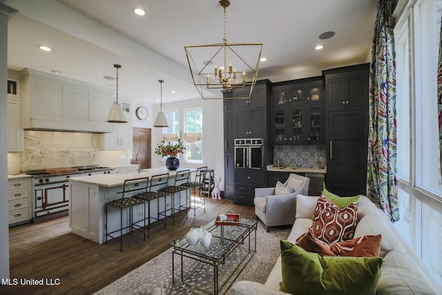 307 Grand Blvd, Greenwood, MS 38930 - living area with recessed lighting, dark wood-style flooring, and a notable chandelier