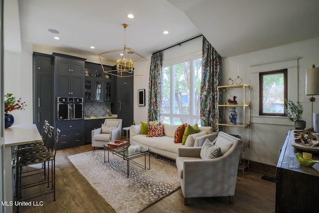 307 Grand Blvd, Greenwood, MS 38930 - living area featuring dark wood-style flooring, a notable chandelier, a wealth of natural light, and recessed lighting