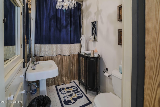 307 Grand Blvd, Greenwood, MS 38930 - bathroom featuring tile patterned flooring and toilet