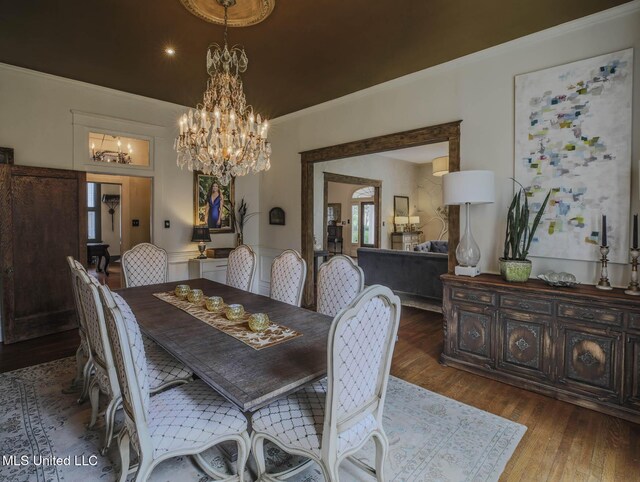 307 Grand Blvd, Greenwood, MS 38930 - dining area featuring wood-type flooring, recessed lighting, crown molding, and a chandelier