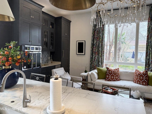 307 Grand Blvd, Greenwood, MS 38930 - interior space featuring baseboards and a notable chandelier