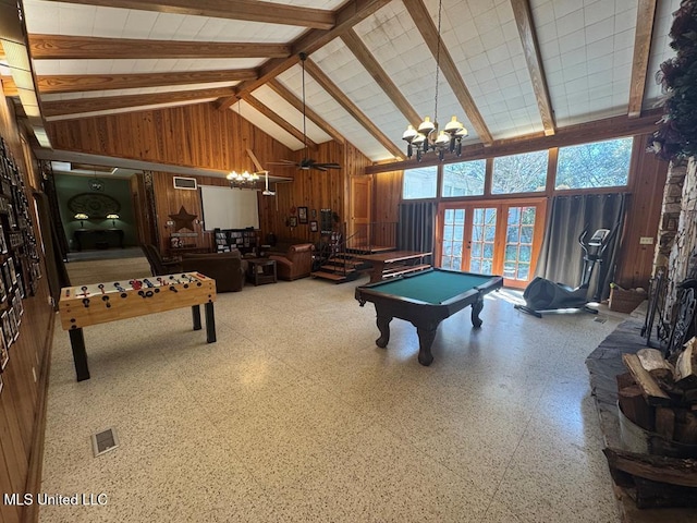 playroom with high vaulted ceiling, wood walls, an inviting chandelier, and billiards