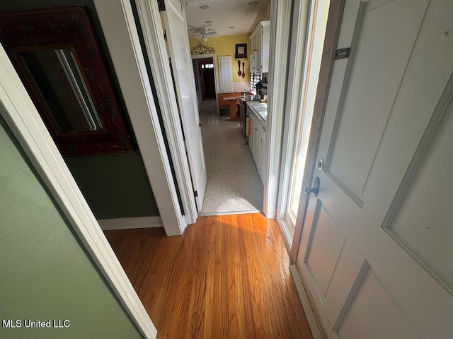 hallway with light wood finished floors
