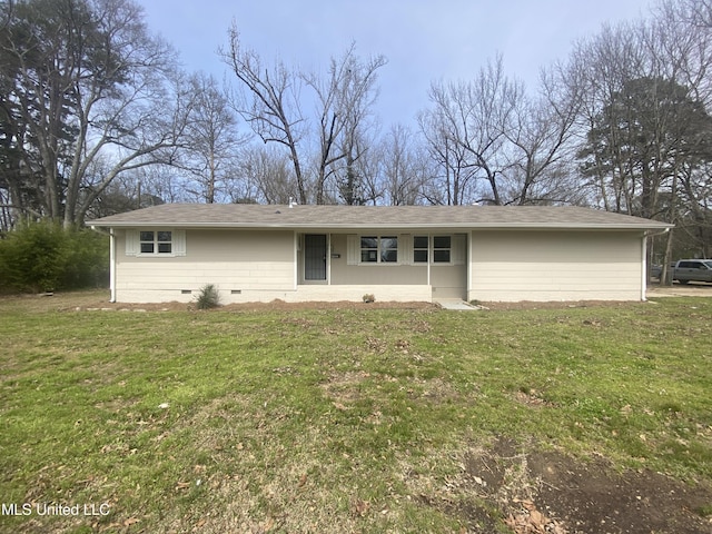 rear view of property featuring crawl space and a yard