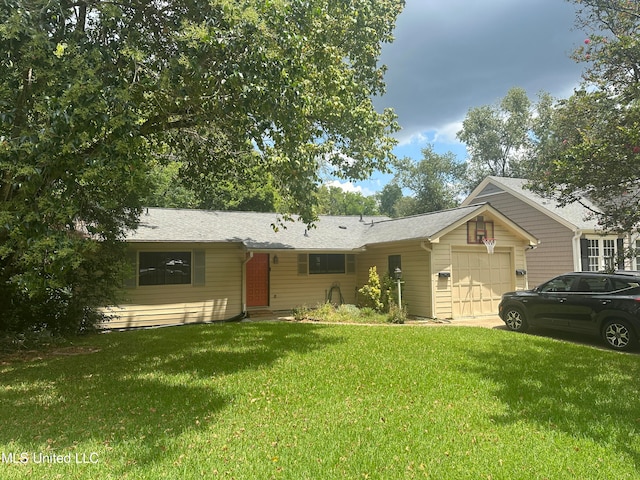 ranch-style home with a front yard and a garage