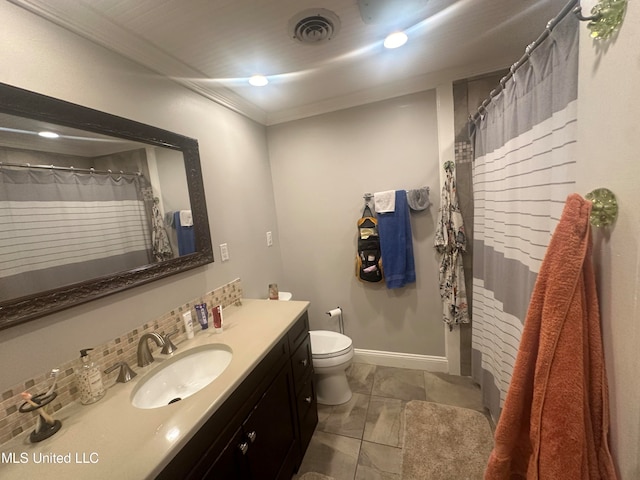 bathroom featuring vanity, crown molding, and toilet