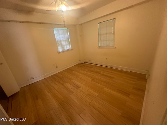 unfurnished room featuring light hardwood / wood-style floors and ceiling fan