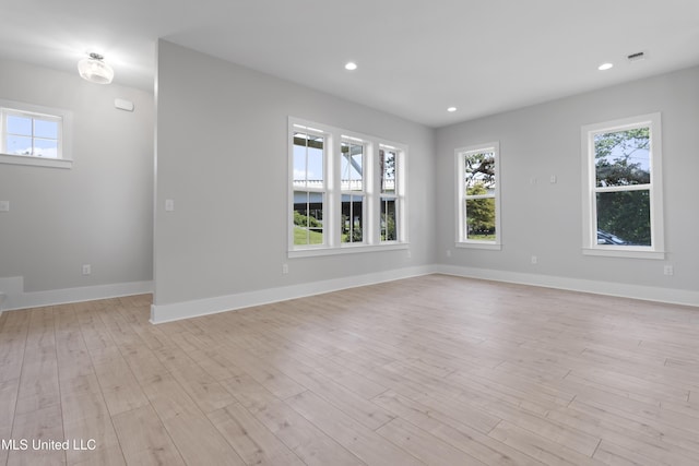 empty room with light wood-type flooring