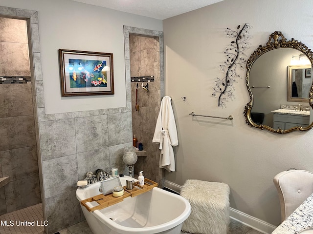 bathroom with tile patterned flooring, separate shower and tub, tile walls, vanity, and a textured ceiling