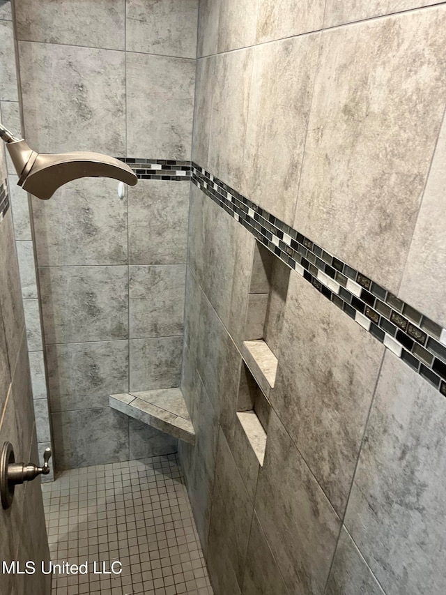 room details with a tile shower