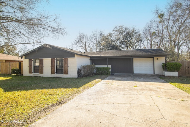 view of front of house featuring fence, an attached garage, a front lawn, concrete driveway, and brick siding