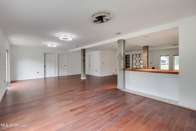 unfurnished living room with hardwood / wood-style flooring