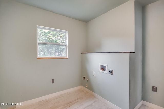 washroom with hookup for a washing machine, hookup for an electric dryer, and gas dryer hookup