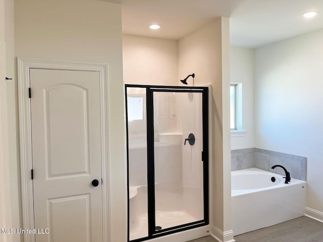 12111 Walker Rd, Ocean Springs, MS 39564 - full bath with a bath, baseboards, wood finished floors, and a shower stall