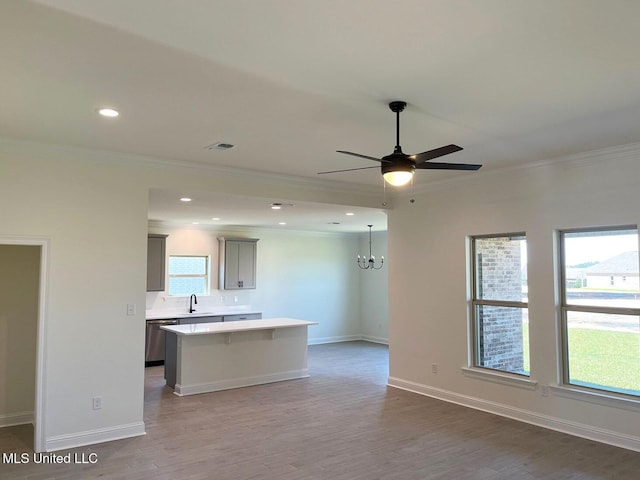 12111 Walker Rd, Ocean Springs, MS 39564 - kitchen with wood finished floors, light countertops, a center island, and dishwasher