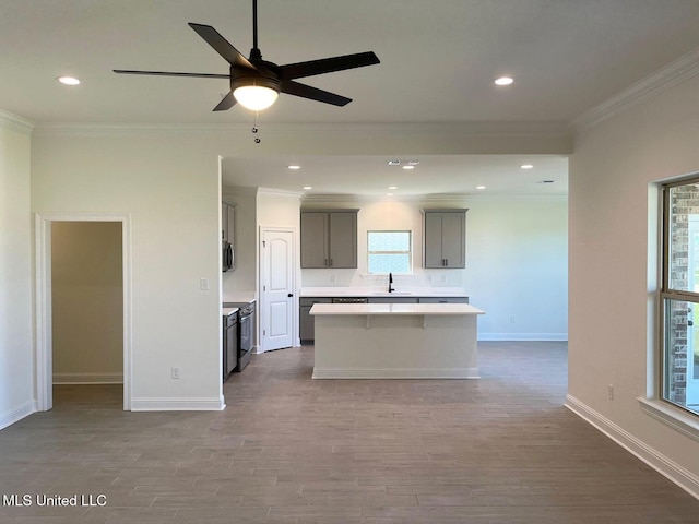 12111 Walker Rd, Ocean Springs, MS 39564 - kitchen with a sink, dark wood-type flooring, light countertops, a center island, and gray cabinetry
