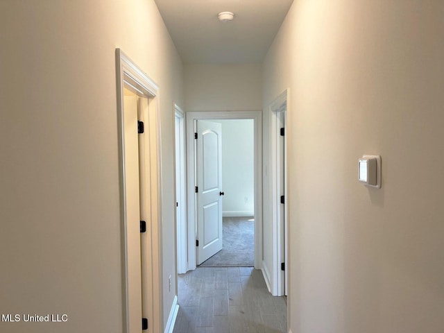 12111 Walker Rd, Ocean Springs, MS 39564 - hall featuring light wood-style flooring and baseboards