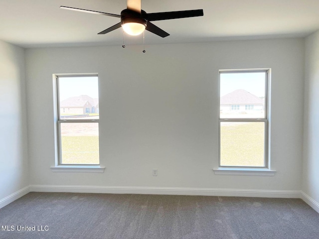 12111 Walker Rd, Ocean Springs, MS 39564 - empty room featuring ceiling fan, carpet, and a wealth of natural light