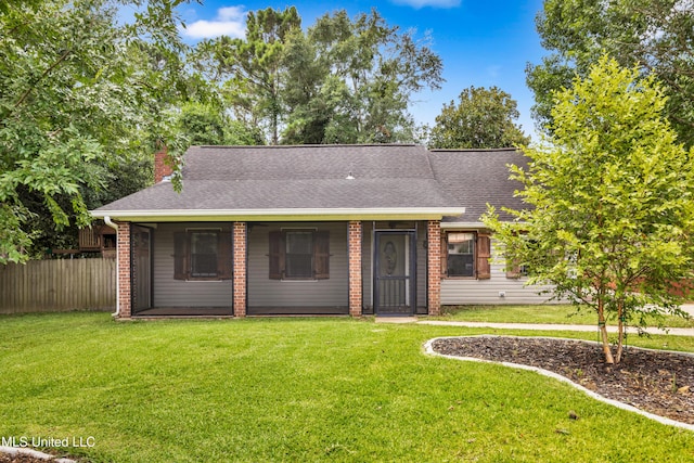 5423 Kaiki Dr, Diamondhead, MS 39525 - view of front facade with a chimney, brick siding, and roof with shingles