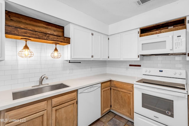 5423 Kaiki Dr, Diamondhead, MS 39525 - kitchen with white appliances, backsplash, light countertops, and white cabinets