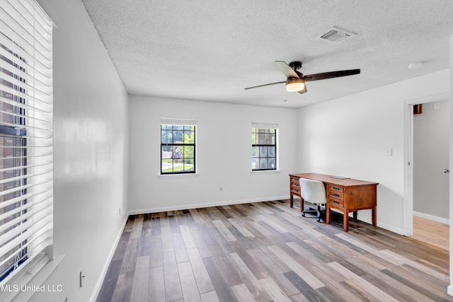 5423 Kaiki Dr, Diamondhead, MS 39525 - unfurnished room with a textured ceiling, wood finished floors, and ceiling fan