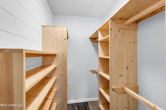 5423 Kaiki Dr, Diamondhead, MS 39525 - spacious closet with dark wood finished floors
