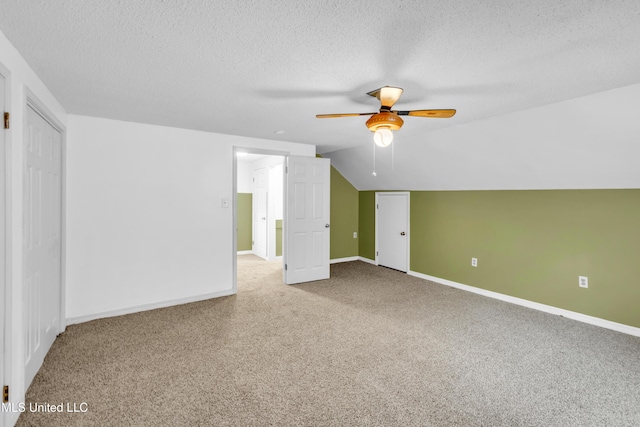 5423 Kaiki Dr, Diamondhead, MS 39525 - bonus room with a ceiling fan, a textured ceiling, carpet floors, and lofted ceiling
