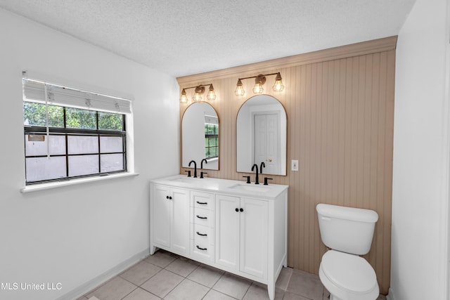 5423 Kaiki Dr, Diamondhead, MS 39525 - full bathroom with double vanity, tile patterned flooring, wooden walls, and a textured ceiling