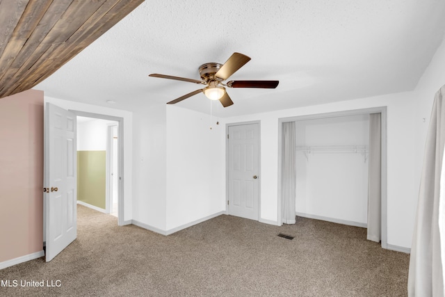 5423 Kaiki Dr, Diamondhead, MS 39525 - unfurnished bedroom with carpet and ceiling fan