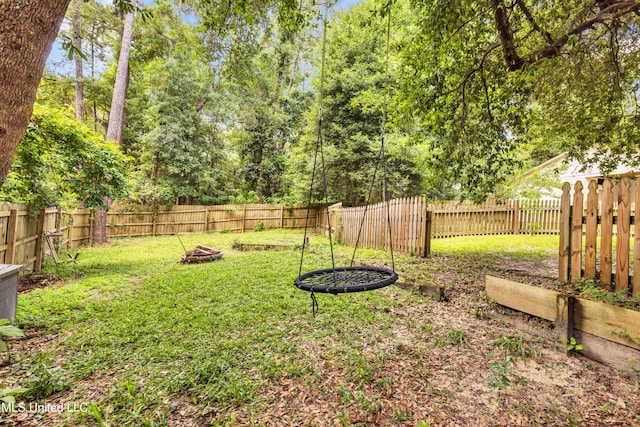 5423 Kaiki Dr, Diamondhead, MS 39525 - fenced backyard with a fire pit