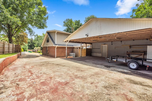 5423 Kaiki Dr, Diamondhead, MS 39525 - view of side of home featuring concrete driveway and brick siding