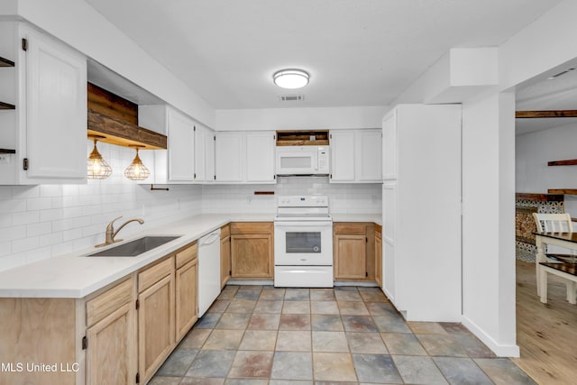5423 Kaiki Dr, Diamondhead, MS 39525 - kitchen featuring white appliances, tasteful backsplash, and light countertops
