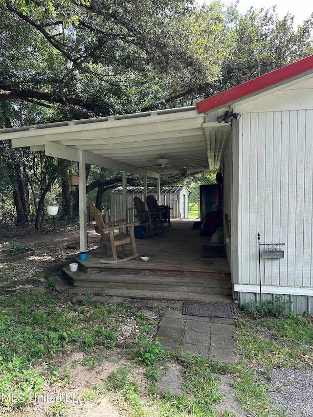 view of parking / parking lot featuring a carport