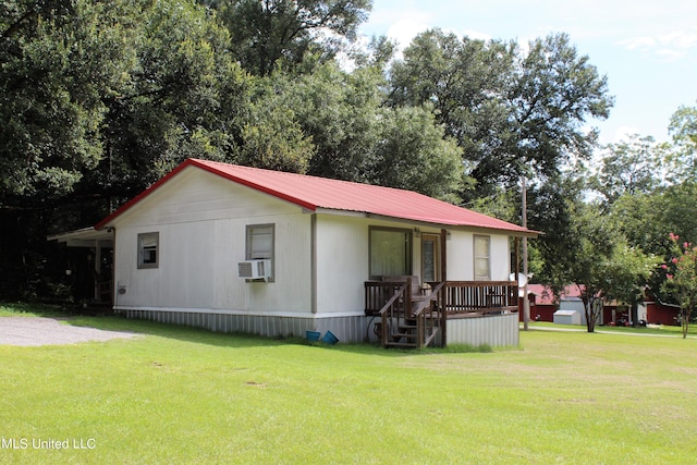 exterior space featuring cooling unit and a lawn