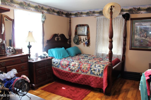 bedroom featuring hardwood / wood-style flooring