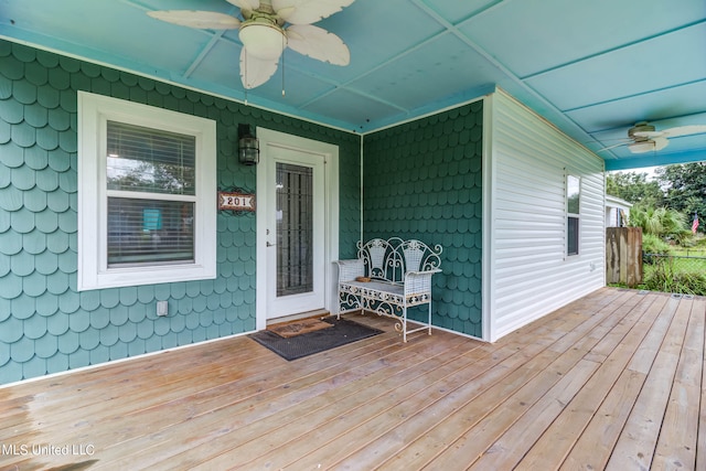 deck with covered porch and ceiling fan