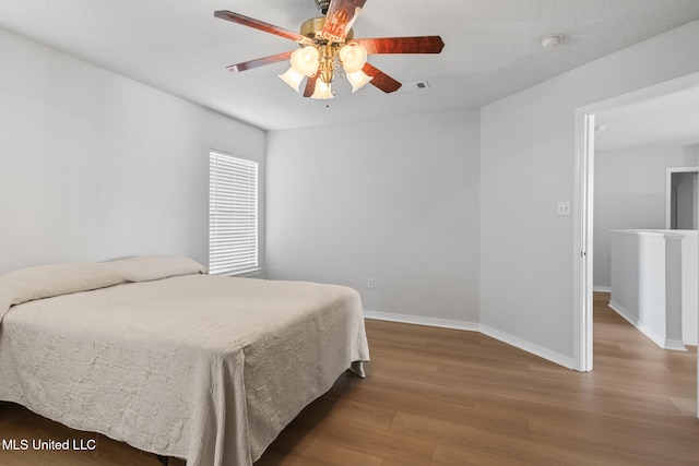 1593 Rachel Dr, Biloxi, MS 39532 - bedroom featuring wood finished floors and a ceiling fan