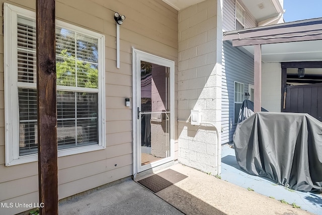 property entrance with concrete block siding