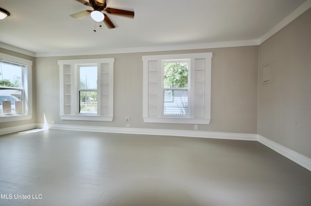2200 19th Ave, Gulfport, MS 39501 - spare room with a ceiling fan, plenty of natural light, baseboards, wood finished floors, and crown molding