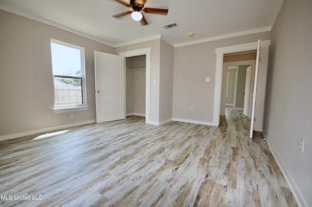 2200 19th Ave, Gulfport, MS 39501 - unfurnished bedroom with wood finished floors, ornamental molding, a closet, baseboards, and ceiling fan