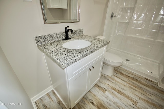 2200 19th Ave, Gulfport, MS 39501 - bathroom with toilet, wood finished floors, vanity, and a shower with curtain