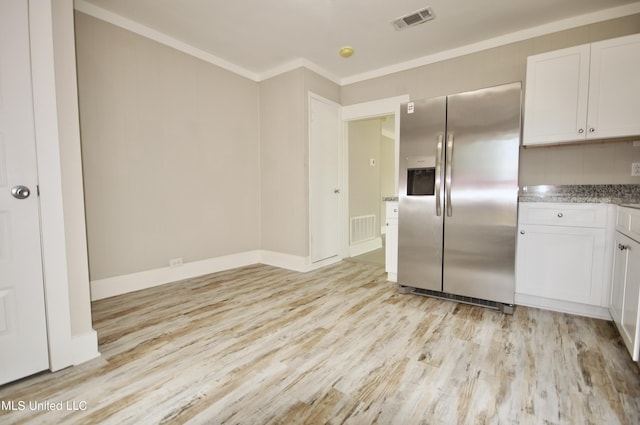 2200 19th Ave, Gulfport, MS 39501 - kitchen featuring stainless steel refrigerator with ice dispenser, light wood-type flooring, white cabinets, crown molding, and light stone counters