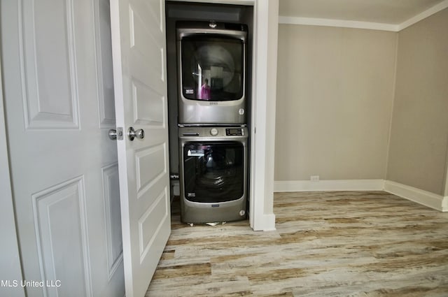 2200 19th Ave, Gulfport, MS 39501 - laundry room with estacked washer and dryer, wood finished floors, and baseboards