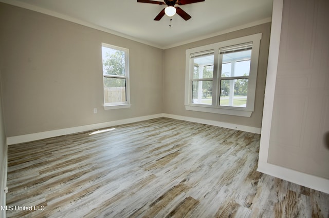 2200 19th Ave, Gulfport, MS 39501 - empty room with a ceiling fan, wood finished floors, baseboards, and crown molding