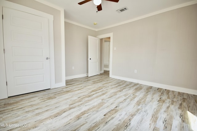 2200 19th Ave, Gulfport, MS 39501 - unfurnished bedroom featuring wood finished floors, crown molding, baseboards, and a ceiling fan