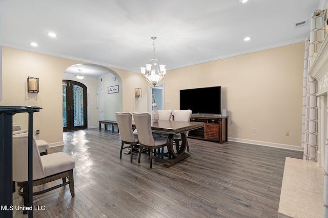 4424 Rebekah Dr, Olive Branch, MS 38654 - dining area featuring arched walkways, dark wood-type flooring, baseboards, a chandelier, and recessed lighting